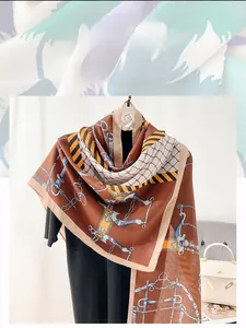 Detail view of cotton linen scarf featuring vintage equestrian horse bit and chain patterns