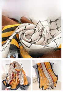 Detailed view of women scarf with bridle and chain print on smooth satin fabric