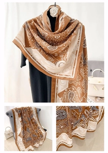 Detailed macro view of retro paisley print on lightweight cotton linen blend scarf