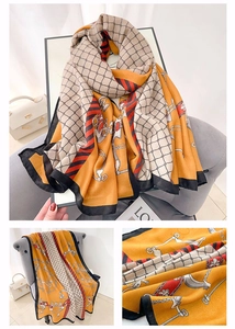 Detailed close-up showing orange equestrian print scarf with vintage metal chain patterns