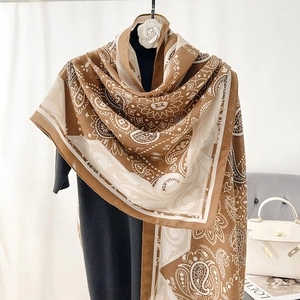 Brown and beige Paisley cotton linen shawl scarf displayed on a hanger in home setting