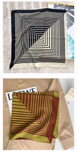 Detail view of modern geometric striped silk scarves styled with shirts and fashion magazine