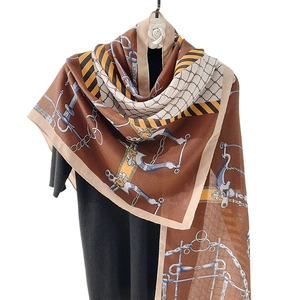 Elegant cotton linen scarf with vintage horsebit and chain print on black sweater