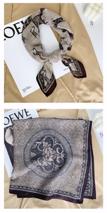 Detail of champagne silk scarf with vintage horse prints and baroque motif decorations