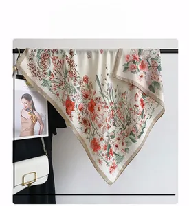 Detail view of 90x90cm square silk scarf with floral print and brown borders