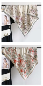 Detail of floral print scarves in gray-purple and orange-red tones with fine seam edges