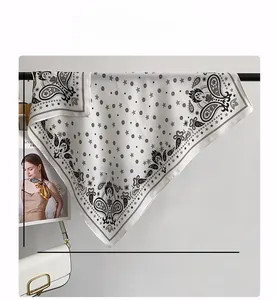 Detail of 68cm black and white paisley print square scarf with star pattern decoration