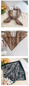 Nahaufnahme eines eleganten Seidentuchs mit Paisleymuster in Vintage Braun und Schwarz