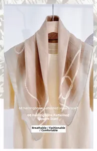 Detailed view of herringbone square scarf with elegant chain patterns on soft beige fabric