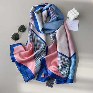Elegant geometric color-block silk scarf with blue houndstooth pattern and smooth texture