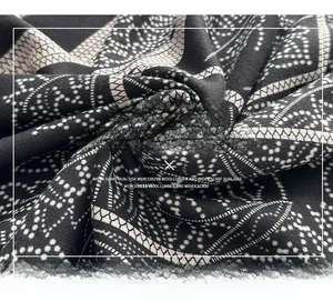 Detail of mercerized wool scarf showing intricate geometric patterns and soft texture