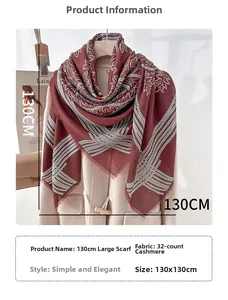 Detail of 130x130cm dark red scarf featuring white geometric patterns and tassel edges