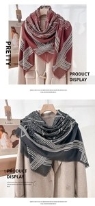 Detail of mercerized wool scarf featuring geometric patterns and fine fringe textures