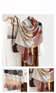 Detail of elegant silk scarf with vintage houndstooth and floral geometric patterns