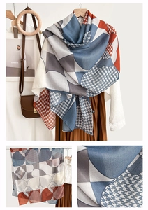 Detail of elegant oversized scarf featuring geometric prints and premium fabric texture