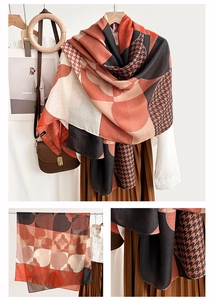 Detailed view of geometric silk scarf featuring houndstooth and abstract patterns