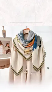 Floral print 130cm square scarf with frayed edges displayed on a beige wool coat