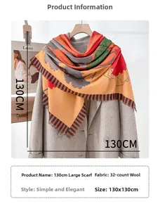 Detail of 130x130cm oversized floral scarf with fringed edges on wool coat