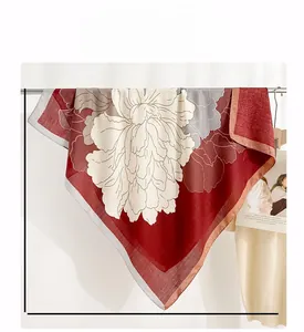 Detail view of square silk scarf showing large red floral pattern and 90cm size specifications