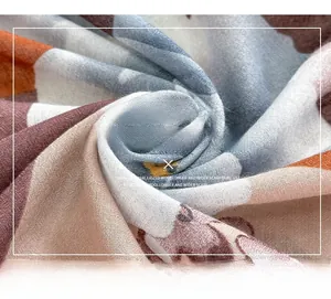Detailed macro view of the mercerized wool scarf fabric with cute cartoon bear pattern