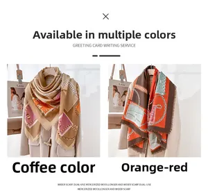 Detail of coffee and orange red silk scarf featuring luxury chain and saddle print pattern