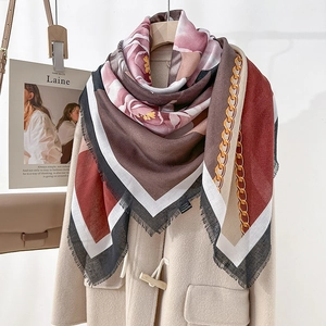 Retro floral print large square scarf with tassels styled on a beige horn button wool coat