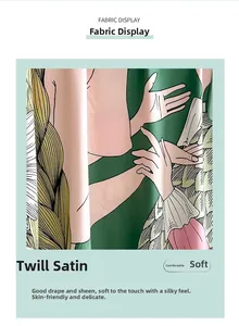 Vue détaillée du tissu en satin de sergé vert menthe avec illustration fine et texture de soie