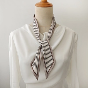 Elegant black and white striped silk scarf with contrast piping for classic French styling