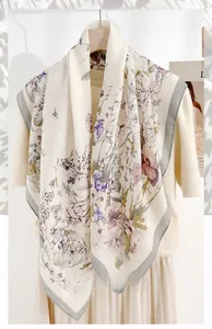 Detail of herringbone silk scarf featuring elegant purple and pink floral prints on mannequin