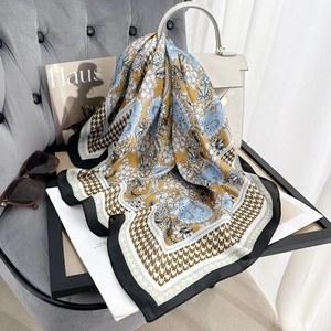 Chic floral and houndstooth print silk scarf styled with luxury accessories and handbag