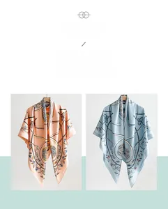 Detailed view of floral silk-textured square scarves hanging with elegant drape and patterns