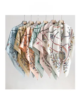Group display of printed silk scarves in various colors hanging on wooden hangers