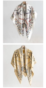 Detailed close-up of classical chain patterns and glossy texture on silk scarves