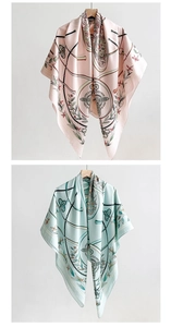 Detail of retro ethnic print silk scarf showing soft pink texture and draped chain pattern
