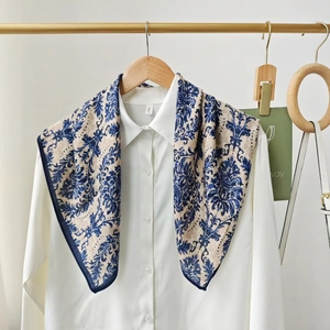 Classic floral silk scarf with damascus pattern displayed on a white shirt