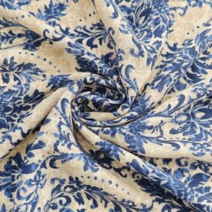 Detail shot of vintage floral silk scarf texture with classic damask pattern in deep blue
