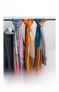 Detail view of new silk long scarves with geometric patterns and soft satin finish