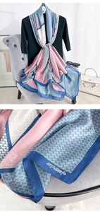 Detail of color-block silk scarf showing houndstooth patterns and soft silky texture