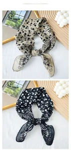 Detail showing paisley and floral prints on khaki and black lightweight silk scarves