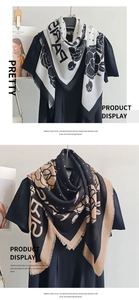 Detail of mercerized wool scarves featuring floral patterns and delicate short fringes