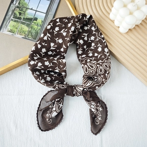 Retro paisley floral print silk scarf for women in dark brown with a stylish knotted design
