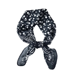 Elegant black and white paisley print square silk scarf for women in a central knot style