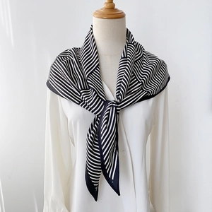 Modern black and white striped satin square scarf styled on a white shirt