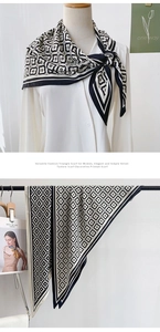 Detail showing the black and white floral geometric print on a soft satin triangle scarf