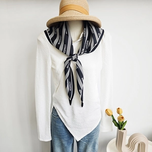 Classic black and white striped silk neckerchief with RESPECT print on casual white shirt