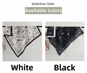 Detail view of white and black silk scarves with floral patterns and pearl prints