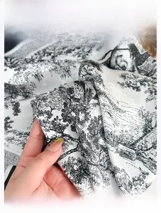 Close-up of Toile de Jouy print on silky fabric showing lightweight drape and smooth texture