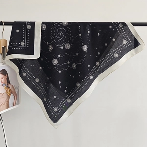 Minimalist black and white silk scarf featuring camellia floral patterns and polka dots