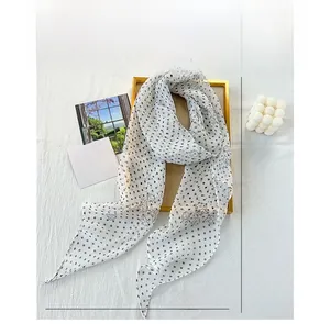 Detailed view of 155x28cm white chiffon scarf with black polka dots and floral print