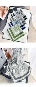 Detailed view of pastoral print square scarves in green and blue silk-like fabric